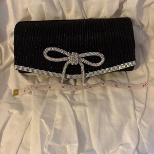 Elegant black chic clutch with attachable strap (included) with rhinestone bow